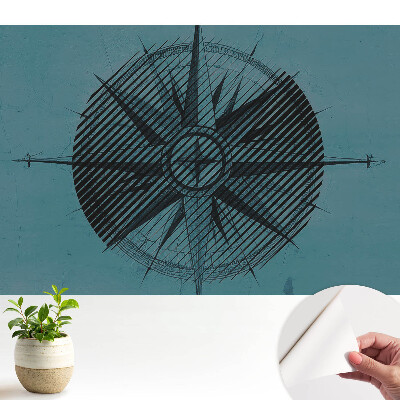 Különleges fotótapéta Egy hajózási iránytű kék ​​háttérrel